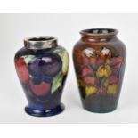 A Walter Moorcroft 'Clematis' pattern flambe vase, of tapered form with everted rim, the body with