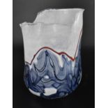 Siddy Langley (b.1955) British, a studio glass freeform vase with uneven frill rim and rounded base,