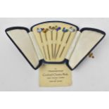 A cased set of six Art Deco sterling silver and enamel cocktail sticks with cockerel finials, in