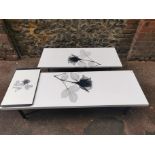Two mid century British design coffee tables, with black and white x-ray rose pattern, together with