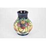 A Moorcroft pottery 'Anne Lily' baluster vase, designed by Nicola Slaney, with tubelined floral
