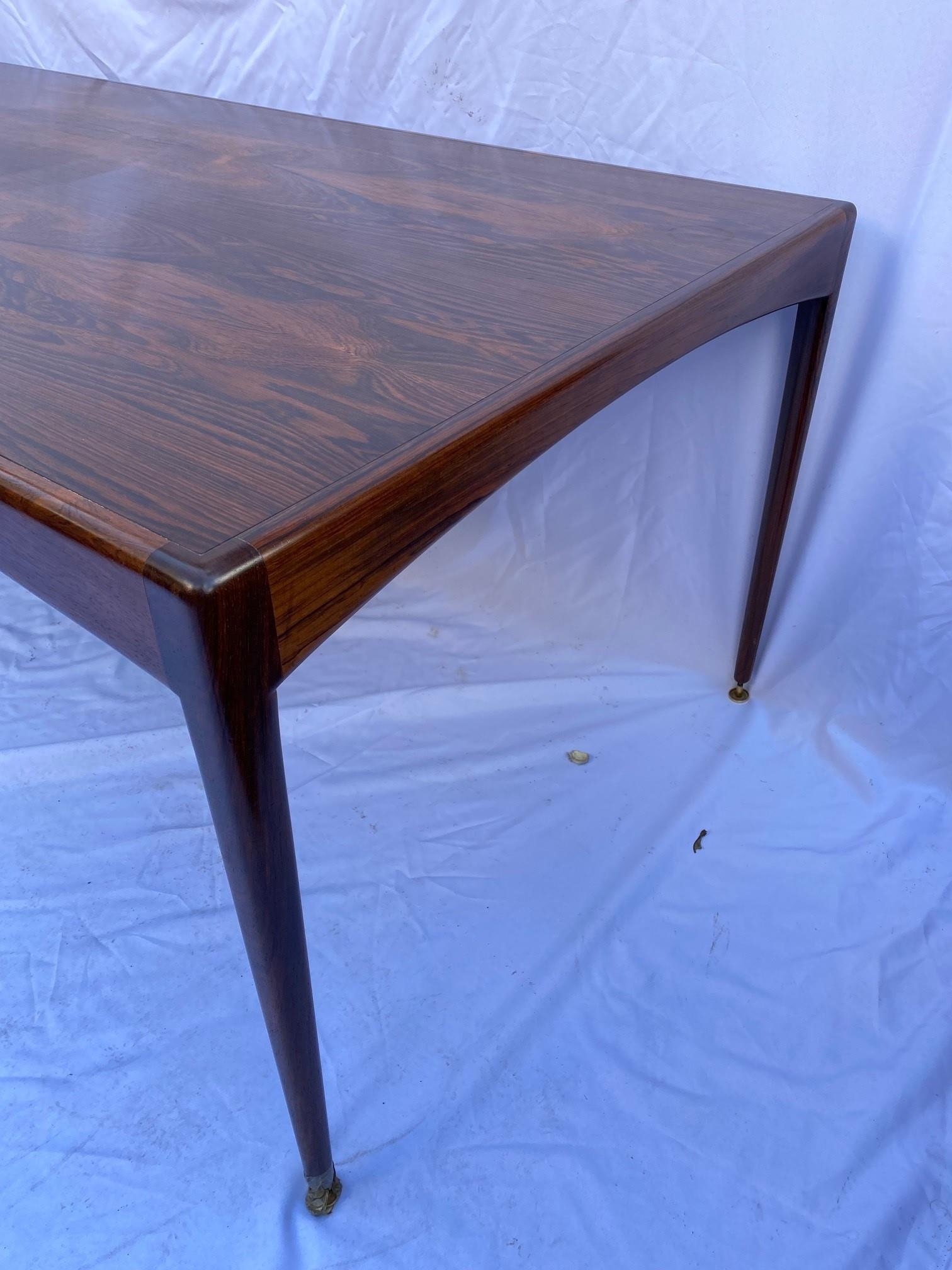 A Heals rosewood dining table, of rectangular form with tapered legs ending in brass disc feet, - Image 3 of 8