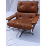 A 1970s Tim Bates for Pieff tan leather and chrome Alpha lounge chair, with button back rest and