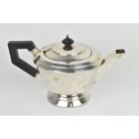 A George VI silver teapot by Charles Boyton, Birmingham 1938, with angular spout and ebonised handle