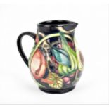 A Moorcroft pottery jug designed by Emma Bossons, in the 'Queen's Choice' pattern, decorated with