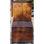 An early 18th century burr walnut bureau cabinet, circa 1720, in the manner of Coxed and Woster, the
