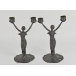 A pair of Art Nouveau pewter figural candelabra, in the WMF style, each modelled as a nymph in