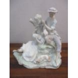 A Lladro Romantic figure group of a couple with grapes resting by a tree stump, model 4662