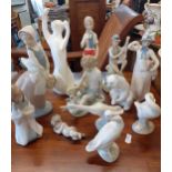 A quantity of late 20th century figures and models to include Lladro, Nao and Rex Location: RAB