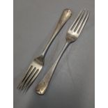 A pair of London 1912 silver dinner forks 101.1g Location: Cab