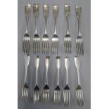 A group of William IV silver forks each monogrammed E, to include six entree forks and six dinner