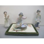 Two Lladro figures It's Your Turn and a Clown, along with another similar, and place mats Location: