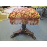 A 19th century rosewood swivel topped piano stool on three lion paw feet Location:SR