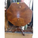 A William IV octagonal form, mahogany snap top table on tripod base Location: FSR