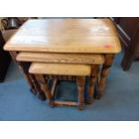 A nest of three oak tables with linenfold carving to the apron A/F Condition: Some damage to the