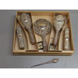 A boxed set of five silver backed dressing table brushes, Birmingham 1958, together with a silver
