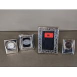 A Britannia 999 silver photograph frame, 12cm x 9cm, a silver photograph frame, a clock case and