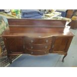 A reproduction mahogany sideboard having a raised back and on cabriole legs 110cm h x 152cm w