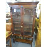 A Victorian mahogany two door glazed bookcase on a later stand, 175.5cm h x 98cm w Location: RWB