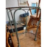 A garden wrought iron painted table and two chairs of rope twist design (no table top) together with