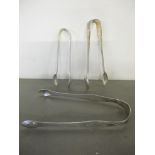 Three silver sugar tongs, one hallmarked London 1803, 72.2g Location: