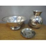 Three Argentinian silver coloured metal items to include a bowl, a dish and a vase Location: