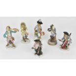 A late 19th century German porcelain part monkey band, to include four larger musicians with