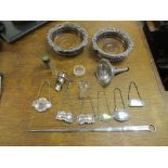 A selection of silver plated items to include a pair of wine coasters, a meat skewer, various