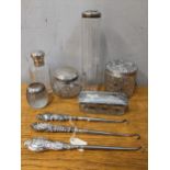 Silver to include five silver and glass dressing table jars, a silver rimmed match strike and