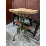 A green painted cast iron and beech topped corner table, 71.5cm h x 50cm w Location: