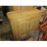 A Victorian pine proving side cabinet with twin cupboard doors raised on later block feet 108cm x