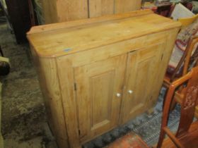 A Victorian pine proving side cabinet with twin cupboard doors raised on later block feet 108cm x