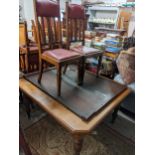 An Edwardian extending dining table with two extra leaves, 74cm h x 139cm w unextended, together