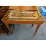 A reproduction Sorrento marquetry inlaid tea table decorated with floral swags and inlaid string