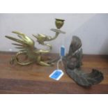 A late Victorian/early 20th century brass candlestick in the form of a dragon with wings