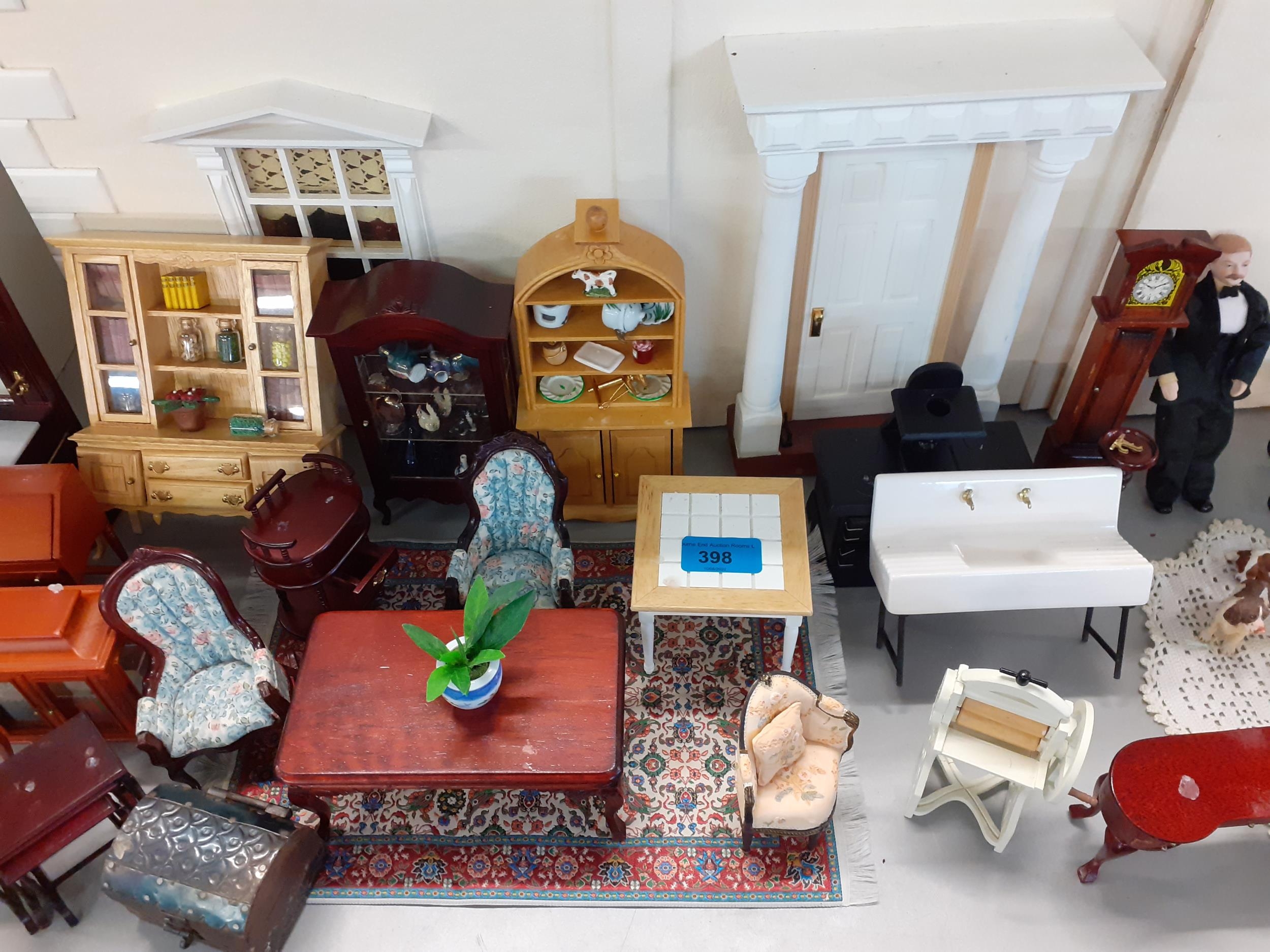 A large quantity of mixed wooden and plastic dolls house furniture to include 3 Willitts Design