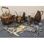 Mixed metalware to include a Moroccan style copper kettle, a silver decanter ladle, miniature silver