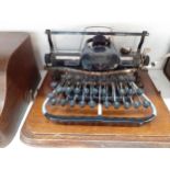 Circa 1900's, an oak cased Blickensderfer typewriter A/F Condition: the leather handle to the