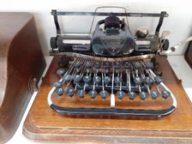 Circa 1900's, an oak cased Blickensderfer typewriter A/F Condition: the leather handle to the