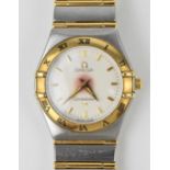 An Omega quartz ladies gold and stainless steel wristwatch having a white enamel dial with gilt