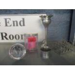 A selection of silver items to include a toast rack, spill vase, small circular photograph frame,