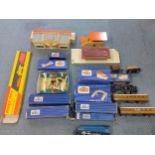 A collection of 00 gauge trains and accessories to include engines, carriages, track and other items