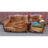A late 19th/early 20th century brown leather upholstered two seater sofa and matching armchair A/F