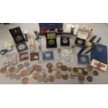 A mixed lot to include British and foreign coinage, commemorative Isle of Man coinage, and others,