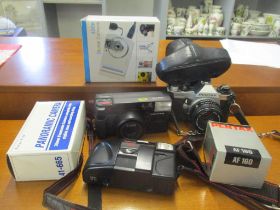Cameras and accessories to include a Pentax MG camera Location: G