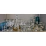 A mixed lot of glassware to include Champaign flutes, wine glasses, a decanter, bells and other