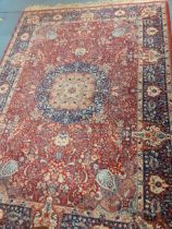 A machine made and red ground rug, 250cm x 170cm, Location: G