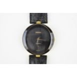A Rado Florence quartz, ladies gold plated wristwatch having a textured black dial with centre