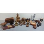 A mixed lot of treen ornaments to include a model of the Buddha, hippos, mushrooms and others,