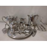 Mixed silver plate to include a toast rack, salad servers, tea set with tray and other items